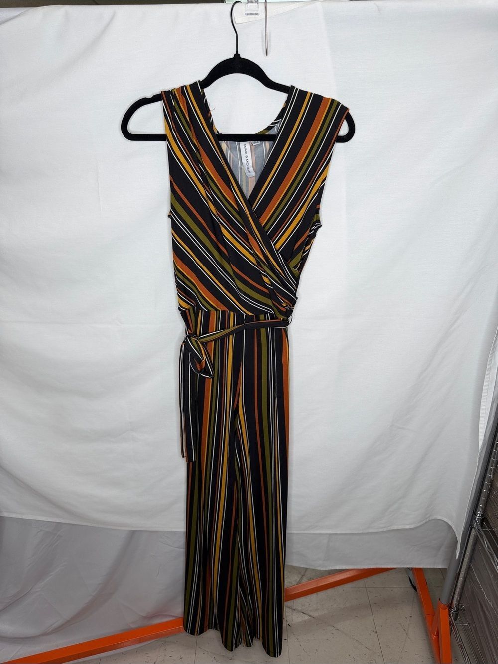 Emma & Michele Black Striped Wrap Jumpsuit with Mustard, Olive, and Rust Stripes
